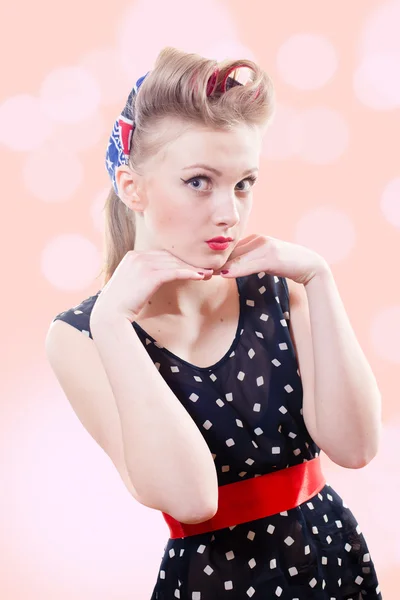 Beautiful blond pinup young woman with victory rolls hairstyle — Stock Photo, Image