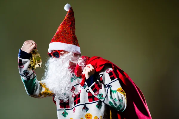 Funky Santa Claus with alarm clock wearing heart shape sunglasses — Stock Photo, Image