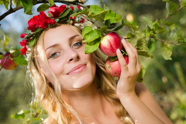Pretty young apple fairy with three fruits — Stock Photo, Image