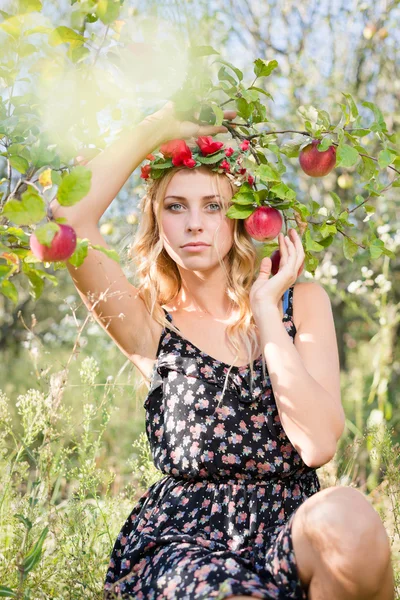 Beautiful young lady apple fairy under branch of ripe fruits — Stock Photo, Image