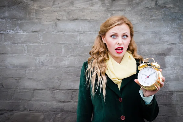 Pretty girl with alarm clock — Stock Photo, Image