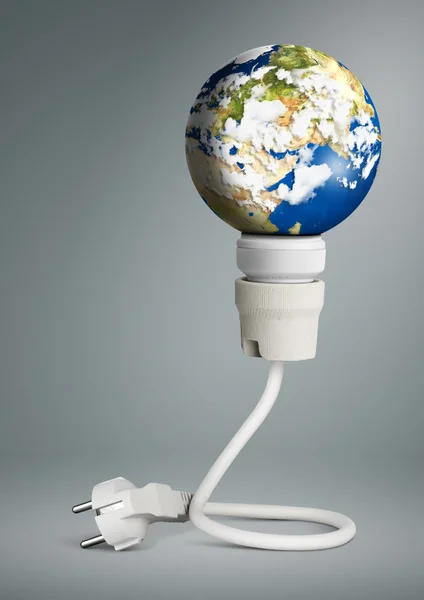 Clean energy concept, light bulb with planet Earth and plug — Stock Photo, Image