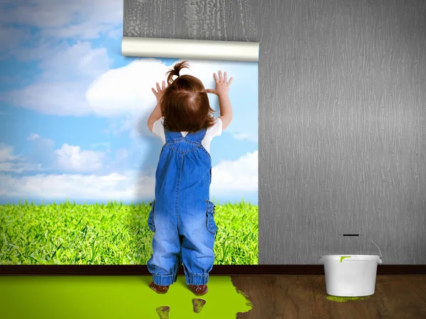 Funny child hanging wallpaper, doing repairs. — Stock Image Funny child hanging wallpaper, doing repairs. Stock Image