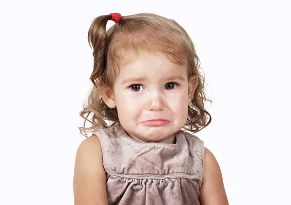 Elszigetelt fehér szomorú sír kislány portréja Stock Fotó