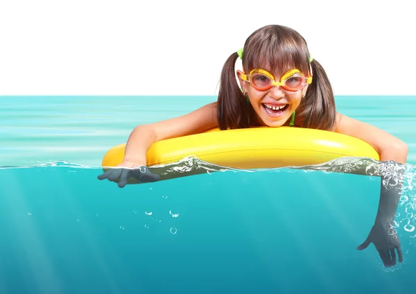 Funny little girl with diving glasses floating inflatable ring, — Stock Photo, Image