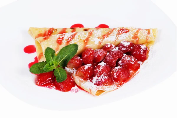 Pancakes stuffed strawberries with mint on plate — Stock Photo, Image