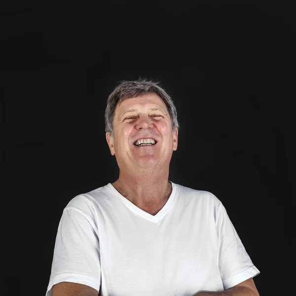 Lachen glücklich lässig gekleideter Mann im Studio — Stockfoto