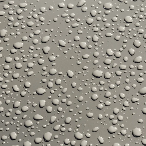 Gotas de agua sobre una superficie metálica —  Fotos de Stock