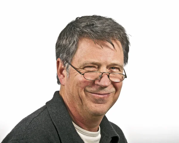 Smiling man with reading glasses — Stock Photo, Image