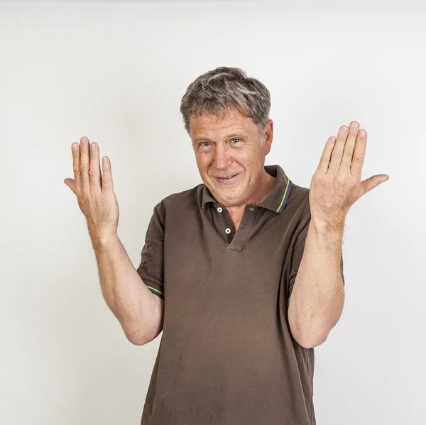 Amigável sorrindo e gesticulando homem — Fotografia de Stock