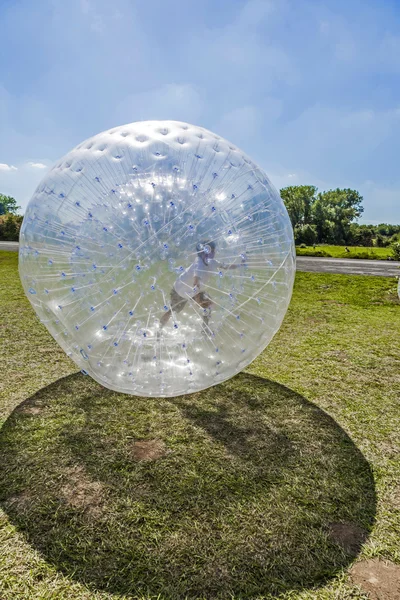 Children have fun in the Zorbing Ball — Stock Photo, Image