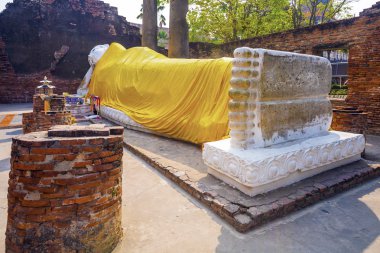 lying Buddha dressed in yellow scarf in temple Wat Yai Chai-mong