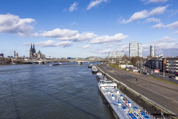 Cologne skyline with dome and bridge and ships on pier — Stock Photo, Image