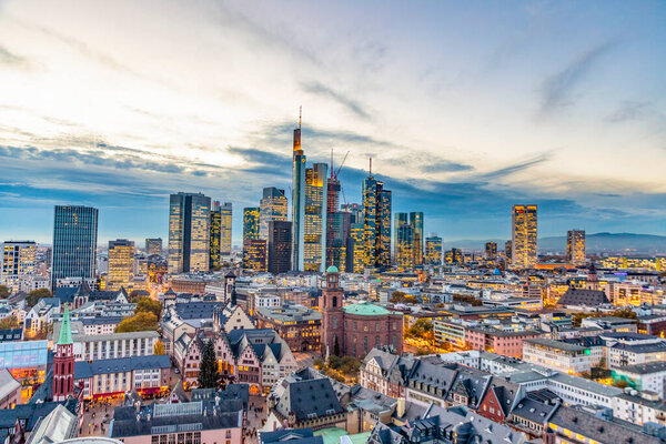 Frankfurt, Germany - November 7, 2018: view to skyline of Frankfurt in sunset with roemer and skyscraper.