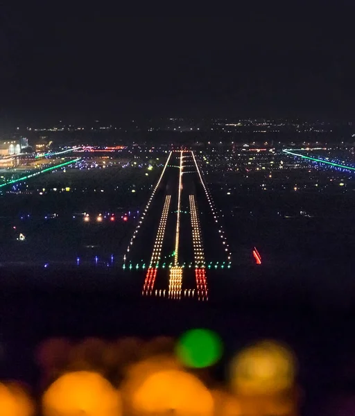 stock image FRANKFURT, GERMANY - OCT 9, 2014: landing by night with a commercaial aircraft  at the airport of Frankfurt, Germany.