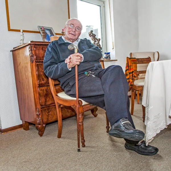 Old Senior Man Enjoys Sitting Living Room Hands Walking Stick — Stock Photo, Image