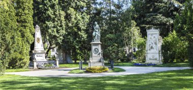 Vienna, Austria - April 26, 2015:  Last Resting Place of composer Ludwig van Beethoven and Franz Schubert and memorial for Wolfgang Amadeus Mozart at the Vienna Central Cemetery. clipart