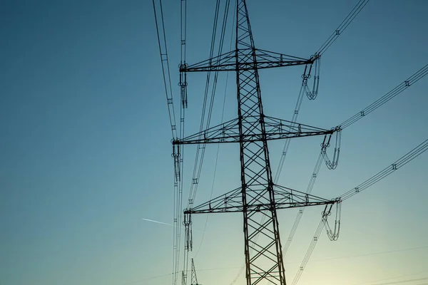 Átkelés Elektromos Pylon Naplemente — Stock Fotó