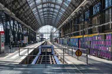Frankfurt, Germany - June 21, 2021: people in the central train station wait for the the train.