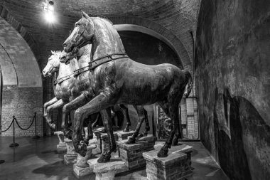Venice, Italy - July 1, 2021: Ancient bronze horses inside the Basilica di San Marco in Venice. Famous quadriga from Constantinople. San Marco or St Mark's Basilica is the main landmark of Venice.