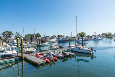 BARNSTABLE, USA - SEP 24, 2017: modern yachts  at the pier in Barnstable harbor. Lobster fishing was in former times the most important industry in Barnstable, USA.