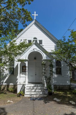 Martha's Vineyard, USA - September 26, 2017: wooden church near gingerbread houses on Lake Avenue, Oak Bluffs on Martha's Vineyard, Massachusetts, USA.