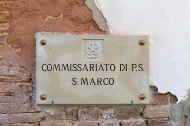 Venice, Italy - July 1, 2021: signage at the facade commissariato - headquarter of local police - in area San Marco, Venice, Italy.