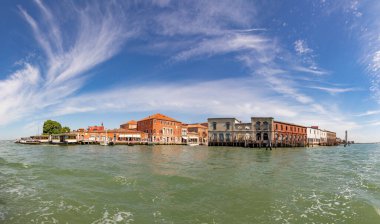 Murano, Italy - July 1, 2021: panoramic view to canal in Murano, the island of venice with historic glass blowing industry.