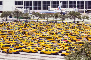 taxis wait at the airport in Miami clipart