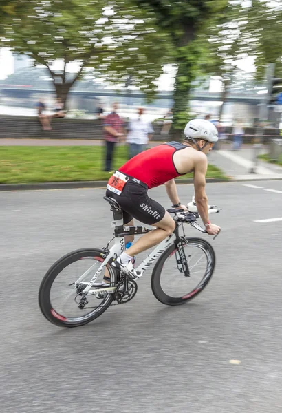 An athlete cycles in the Cologne Triathlon — Stock Photo, Image
