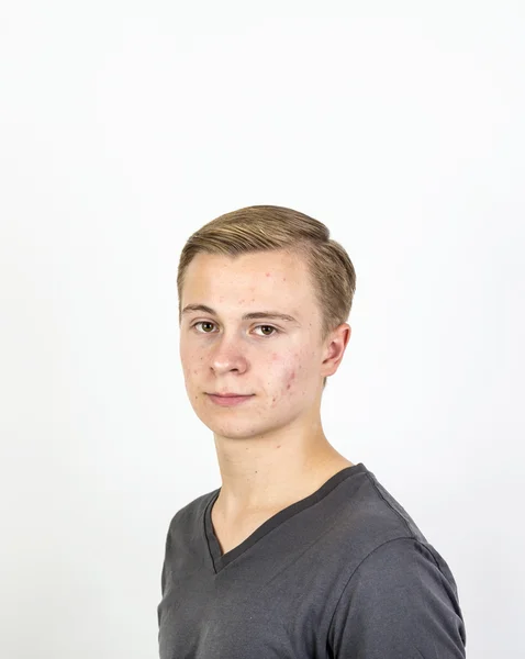 Handsome teenage boy looking at the camera — Stock Photo, Image