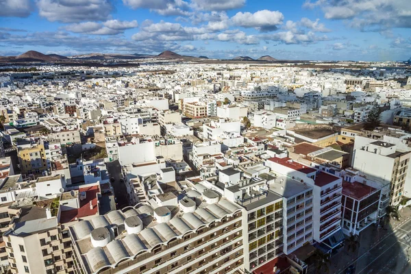 Aerial view to Arrecife with volcanoes in the background — Stock Photo, Image