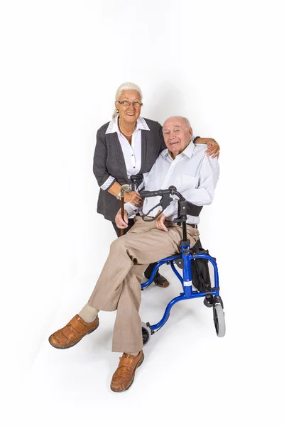 Happy senior couple with man in wheelchair — Stock Photo, Image