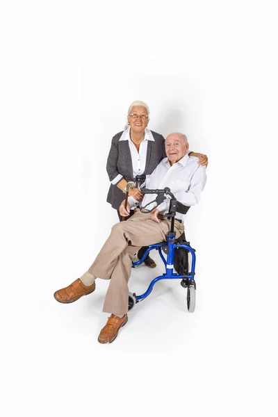 Happy senior couple with man in wheelchair — Stock Photo, Image