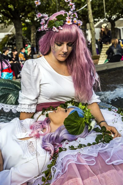 Colorful girl made up as Manga girl and poses for photographers — Stock Photo, Image