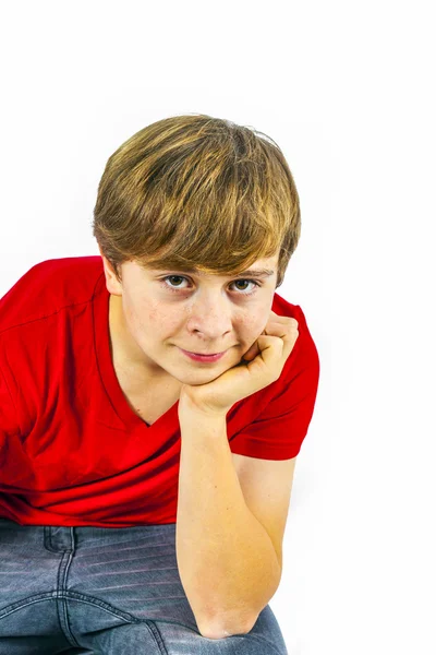 Smart boy sitting on a chair — Stock Photo, Image