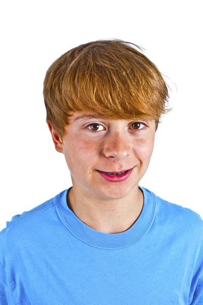 Portret van gelukkige jongen met blauw shirt in studio — Stockfoto