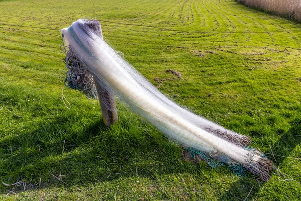 Fishermans net drying in the sun — Stock Photo, Image