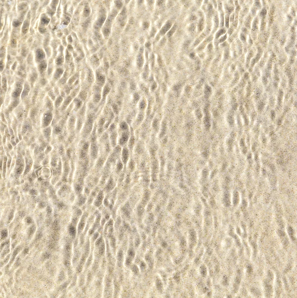 Patrón de agua en la playa de arena — Foto de Stock