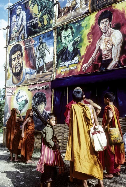 Monks watch the advertising of a cimena — Stock Photo, Image