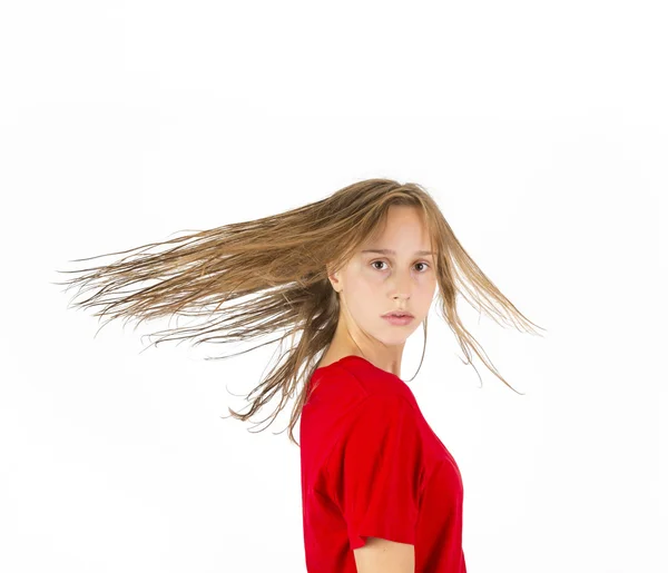 Tiener meisje met bruin haar in beweging — Stockfoto