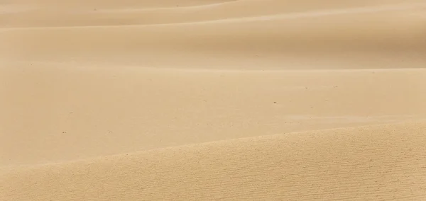 Deserto padrão de areia textura fundo da areia na duna — Fotografia de Stock