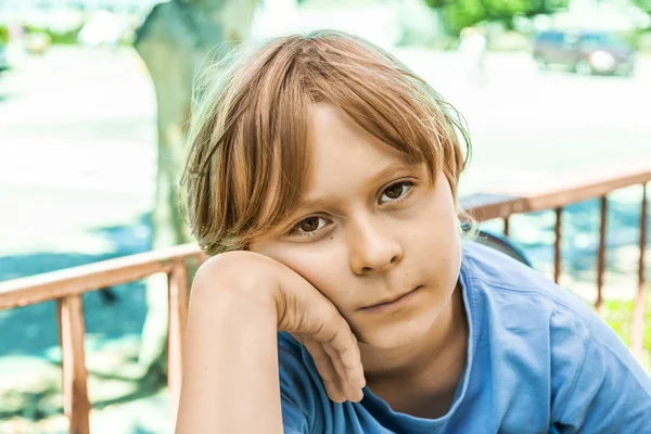 Boy with brown hair looking displeased — Stock Photo, Image
