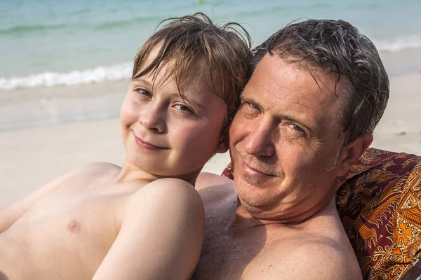 Father is spooning with his happy smiling son — Stock Photo, Image