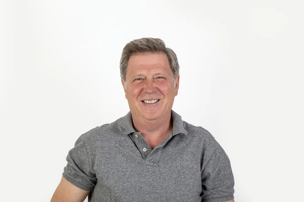 Smiling mature man with grey polo shirt — Stock Photo, Image