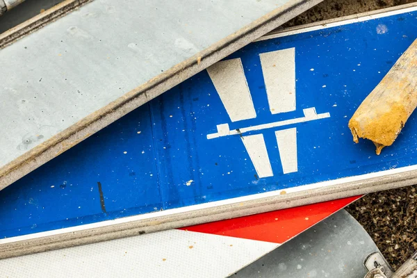 Many traffic signs lying at the ground — Stock Photo, Image