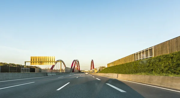 Looking through front shied of a car to the highway — Stock Photo, Image