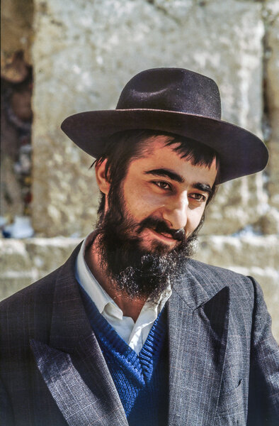 Orthodox jewish man prays at the Western Wall 