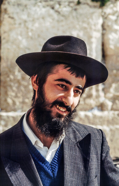 Orthodox jewish man prays at the Western Wall 