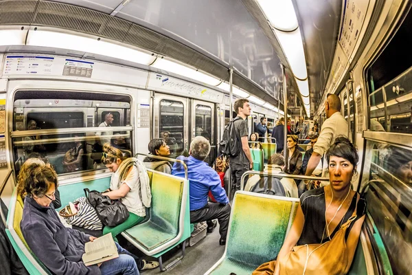 Tourists and locals on a subway train in Paris